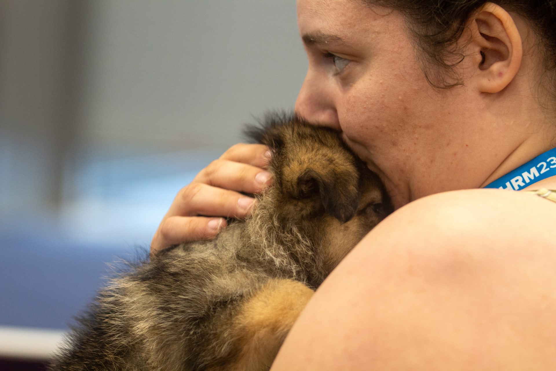 Lucy Hammer, people operations specialist at Addgene, snuggles with Flame. (Mauro Whiteman/SHRM)